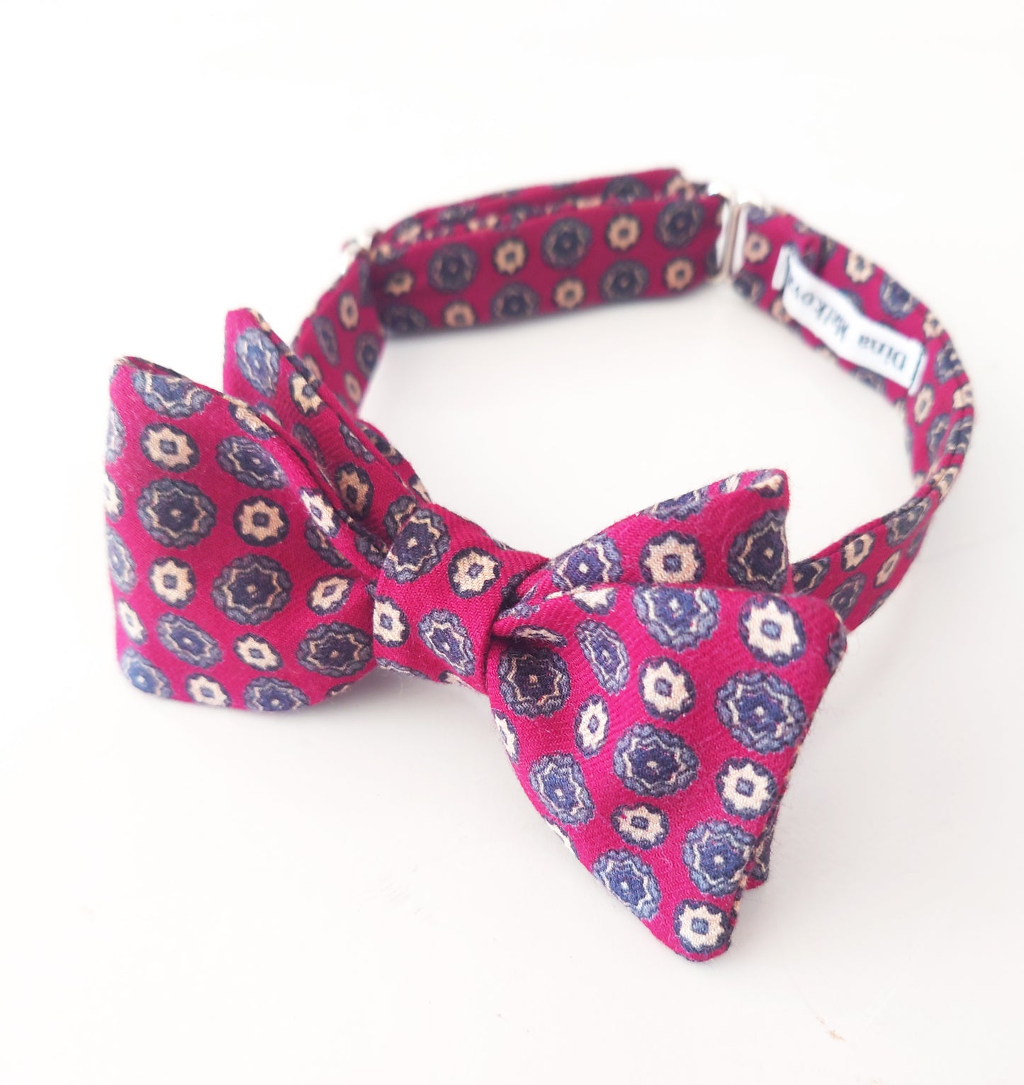 Pink floral patterned bow tie on a white background by lewesbowties.co.uk