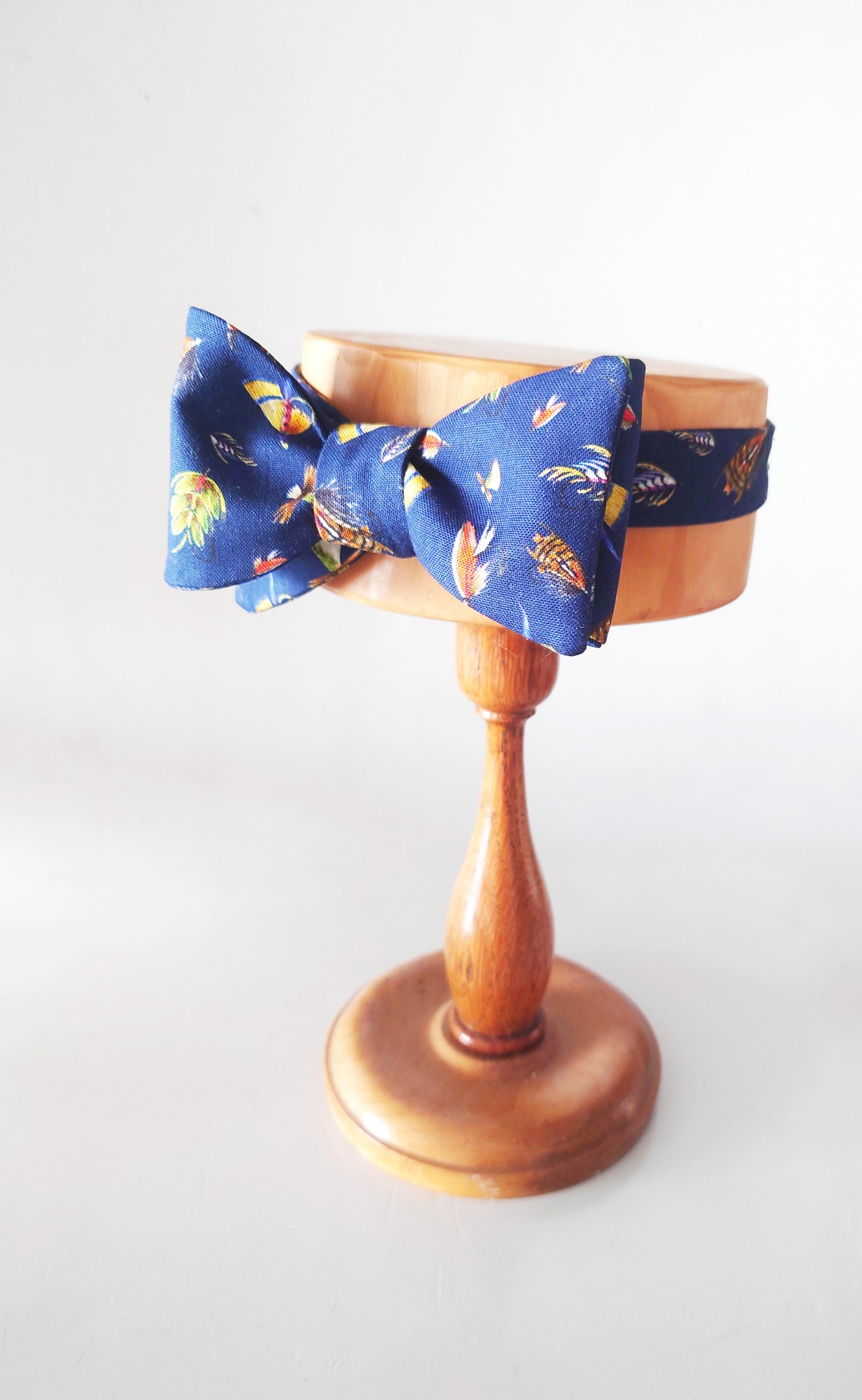 Navy blue cotton bow tie with fishing flies all over