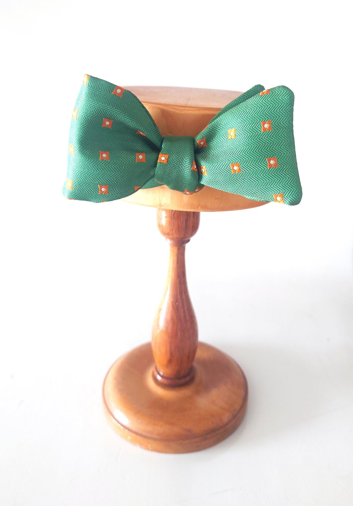 green silk with orange pattern bow tie