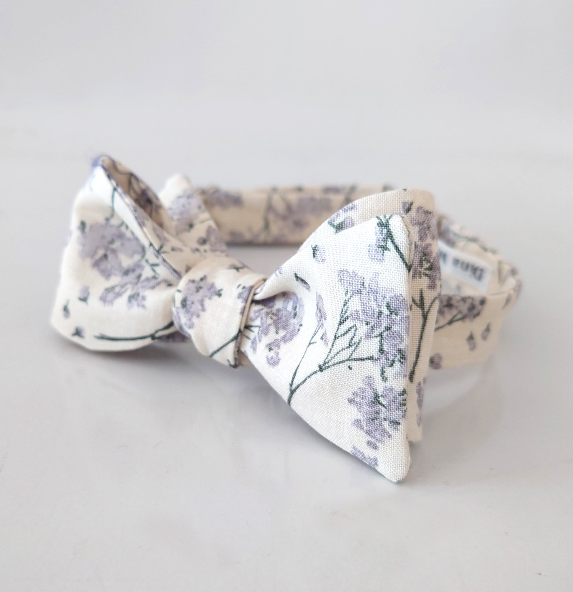 Floral patterned bow tie on a light grey background wedding bow tie