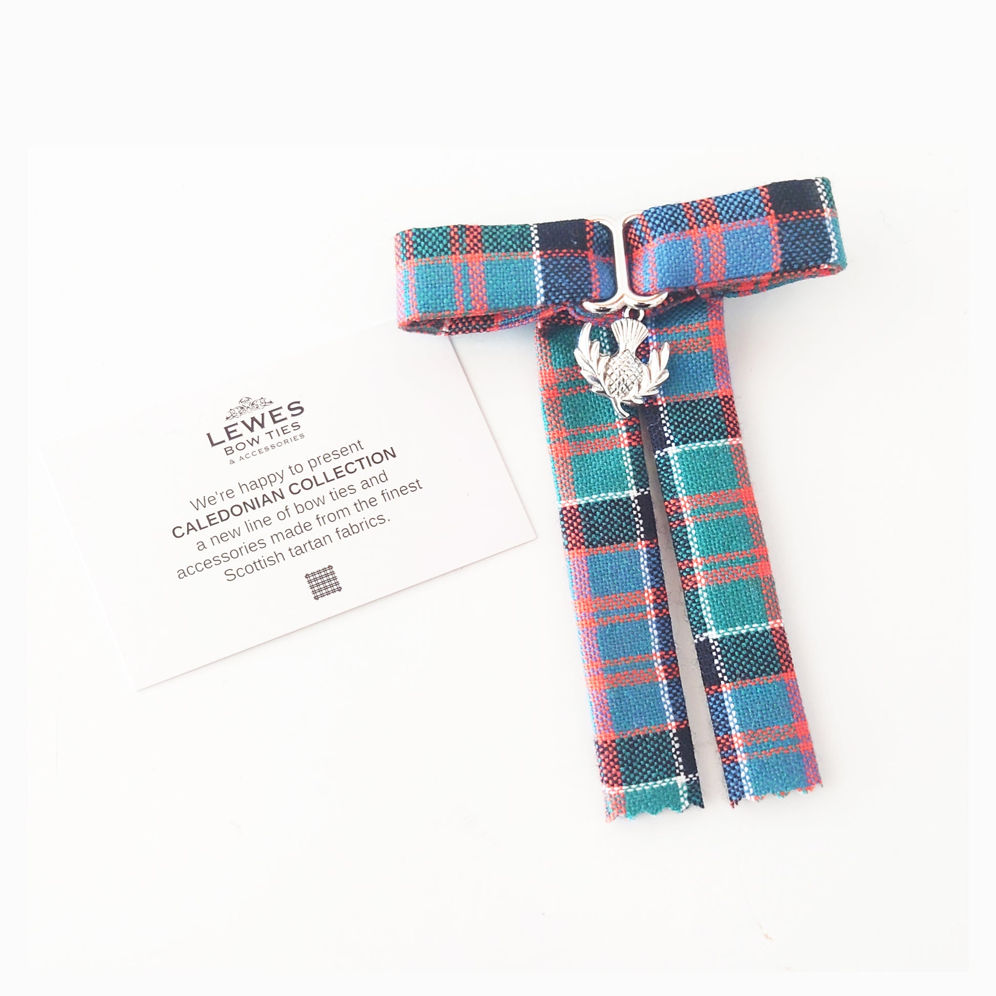 Plaid tartan thistle pin brooch from Scottish clan McDonald of Clanranald