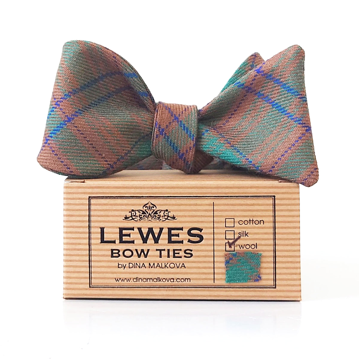 MacGillivray wool tartan bow tie in earthy green, brown, and blue tones, presented on top of Lewes Bow Ties gift box.
