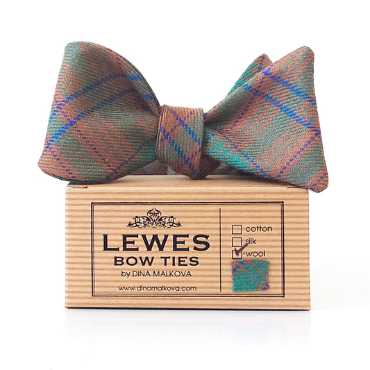 MacGillivray wool tartan bow tie in earthy green, brown, and blue tones, presented on top of Lewes Bow Ties gift box.
