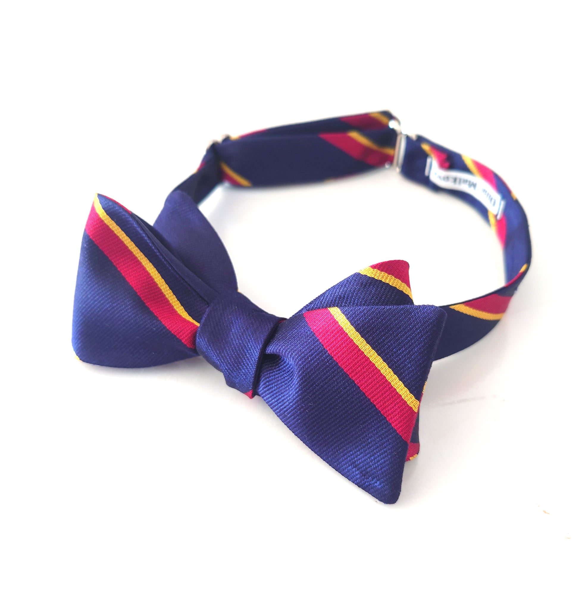 Blue bow tie with red and yellow stripes on a white background