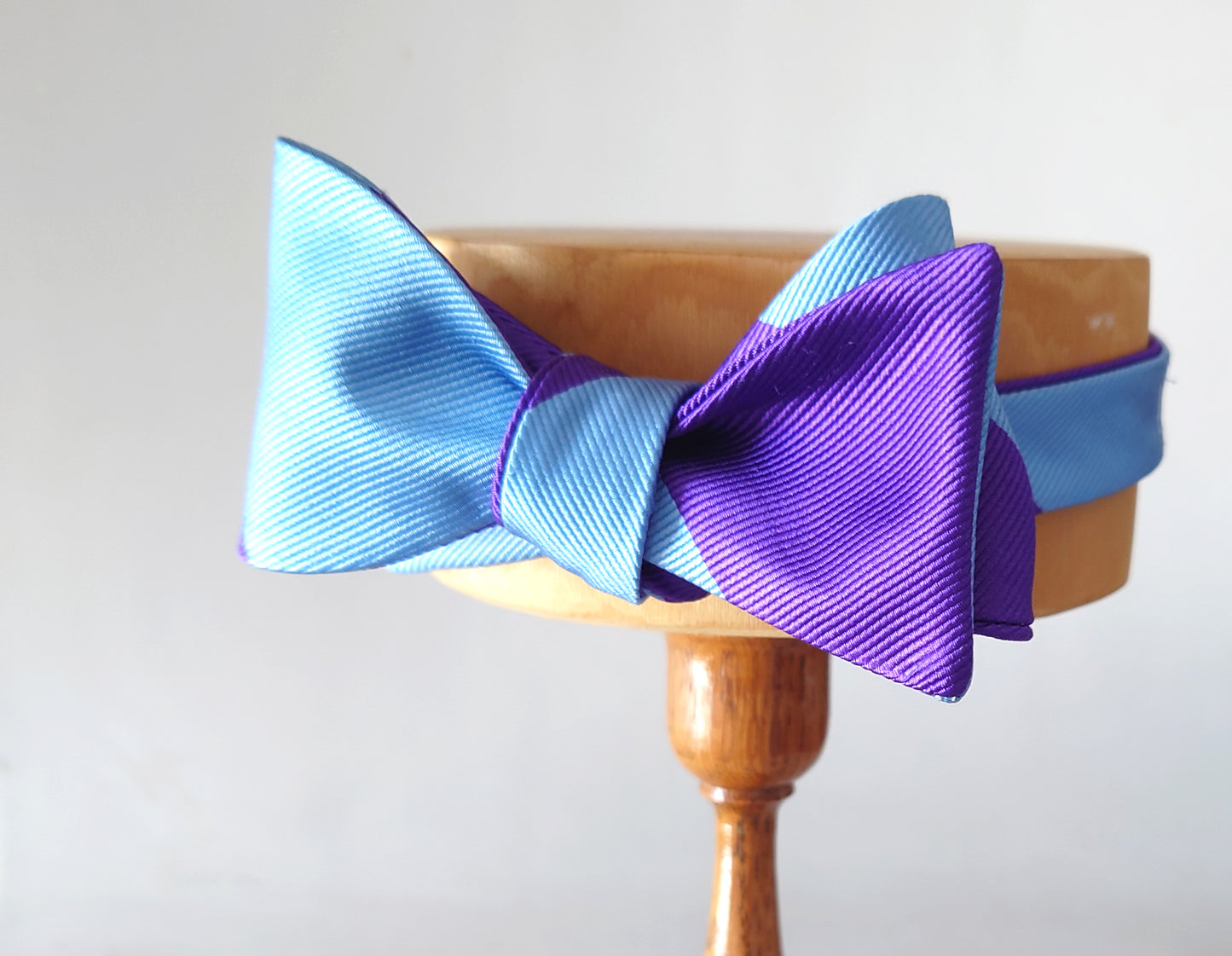 violet and blue striped bow tie