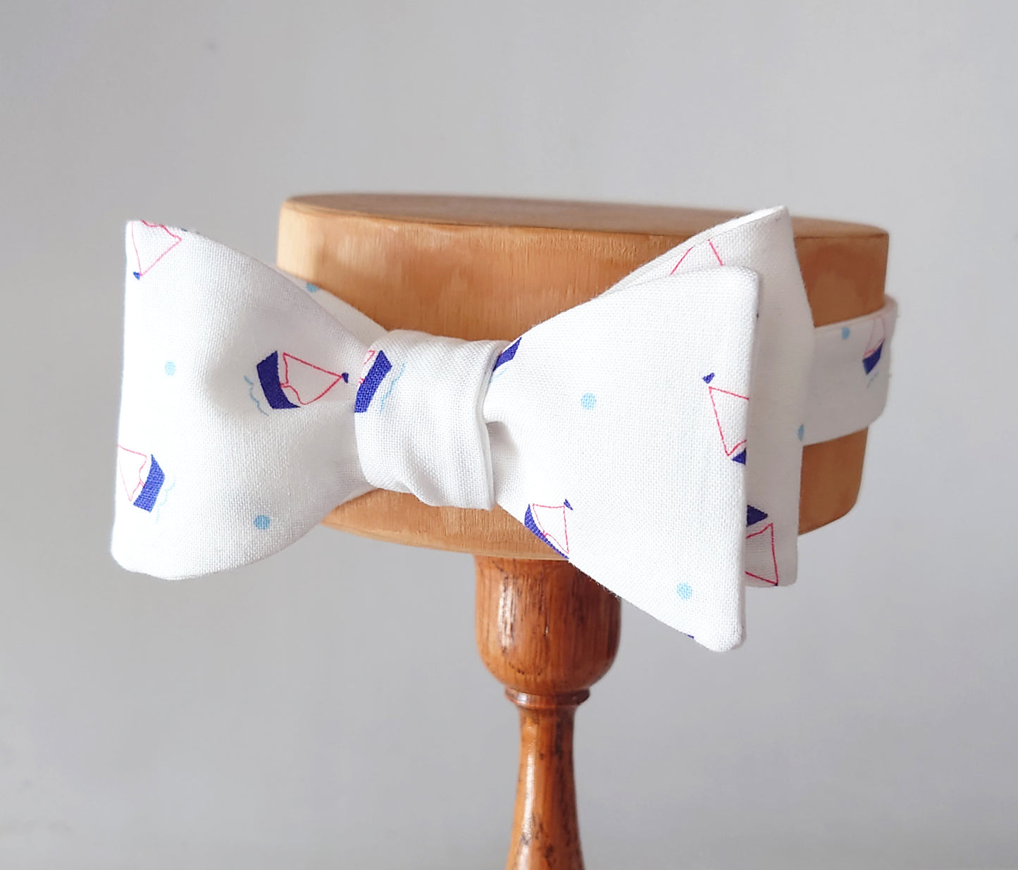 white cotton bow tie with yacht print all over