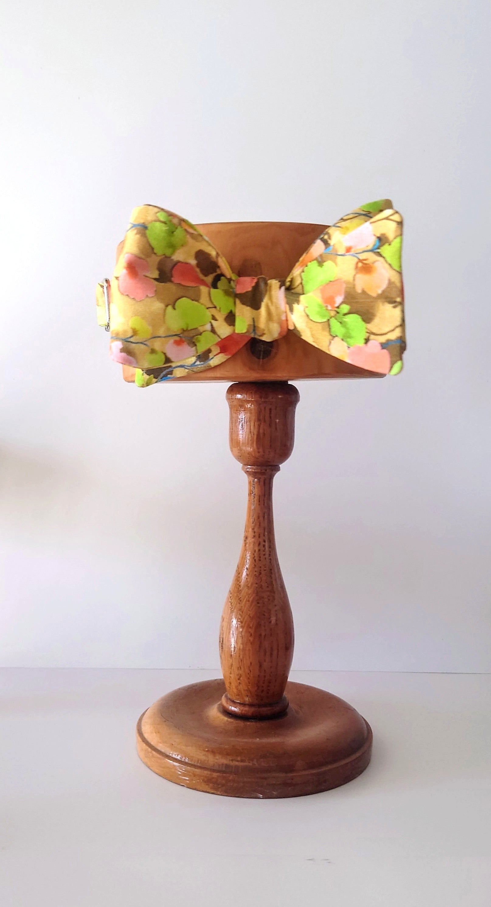 yellow floral self tie bow tie on stand